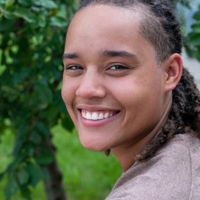 Headshot of Jaylin in front of a tree