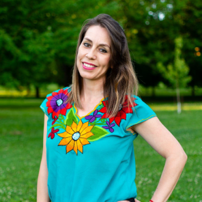 Rosalba standing outside in front of trees